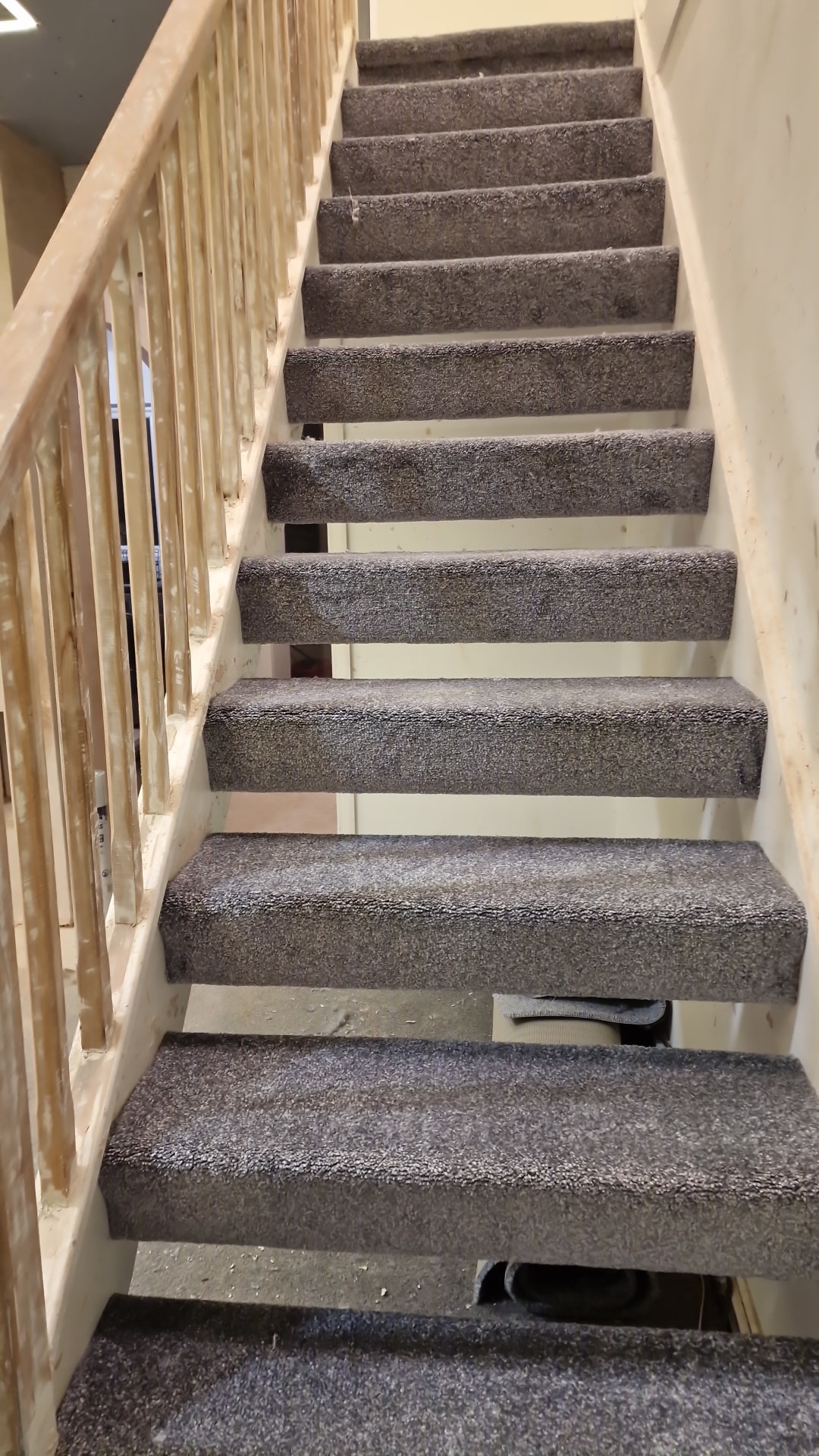 Grey carpet stair fitting